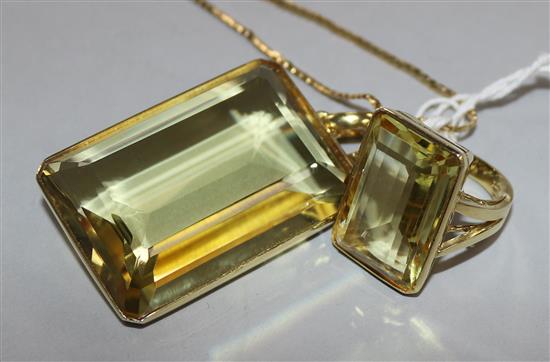 A modern 14ct gold mounted large citrine pendant on 9ct gold chain and a similar 14ct gold dress ring.